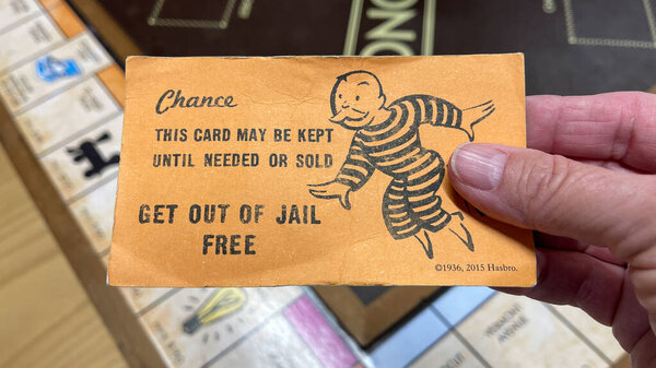 Orlando, FL USA - January 25, 2021: A get out of Jail Free card from a monopoly set. Помилование концепции, президентская, деловая, банковская и финансовая.