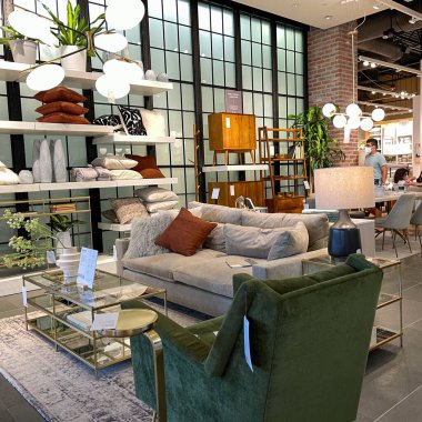 Orlando, FL USA- March 6, 2021 :  A couch , chair and tables display at a West Elm Midcentury Modern furniture store in Orlando, Florida. clipart