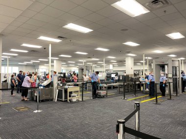 Sanford, FL USA - May 13, 2021:  The TSA security area at the Orlando Sanford International Airport SFB in Sanford Florida. clipart