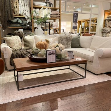 Orlando ,FL USA -  September 4, 2021:  A display of couches and tables  at a Pottery Barn at an indoor mall in Orlando, Florida. clipart