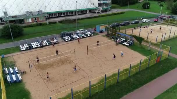 Beach volleyball competitions on lake shore. — Stock Video