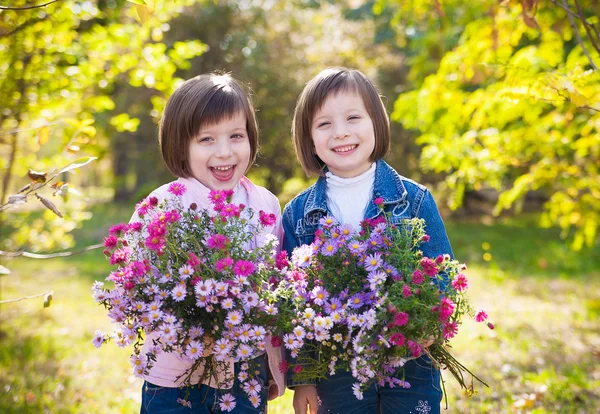 Portrait of happy two little girls twins relaxing and enjoying l — Stock Photo, Image