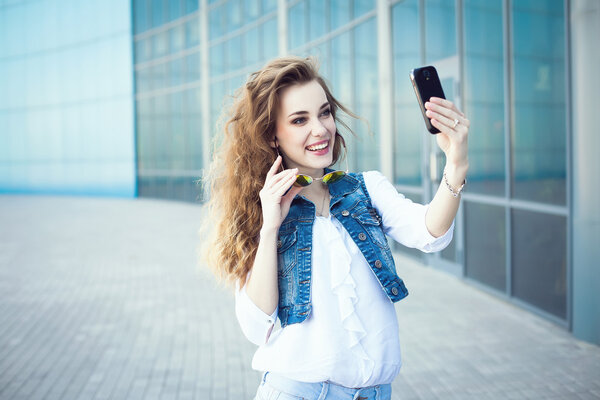 Technology internet and happy people concept - beautiful girl ta