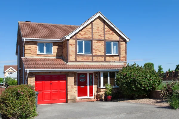 Elegant new house with red door — Stock Photo, Image