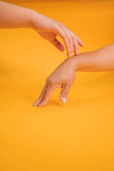 Concept of mother and daughter hands outstretched to get in touch.