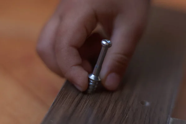 Man Hand Holds Screw Furniture Assembly Home Carpentry Session — Stock Photo, Image