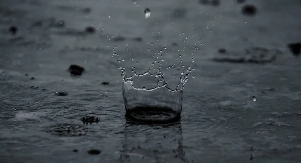 Rain water drop falling to the floor in heavy rain day