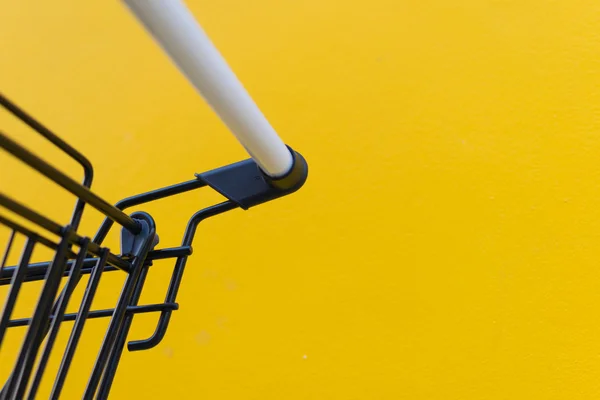 Minimalism style, Shopping cart and yellow wall. — Stock Photo, Image