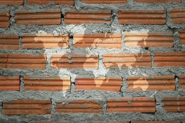 Red Brick wall texture surface with world map — Stock Photo, Image