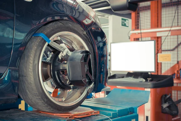 Checking car suspension — Stock Photo, Image