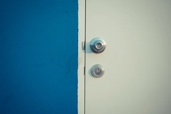 Minimalism style, Blue wall and white door. Stock Picture