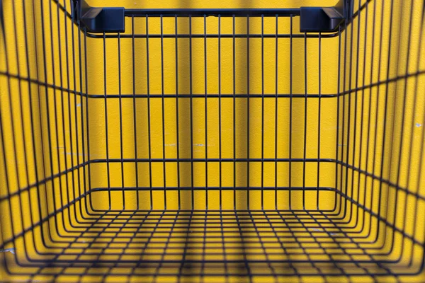 Minimalism style, Shopping cart and yellow wall.