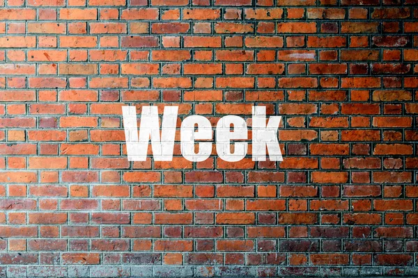 Red Brick wall texture with a word Week — Stock Photo, Image