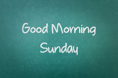Green blackboard wall texture with a word Good Morning Sunday