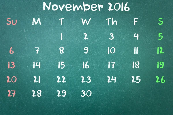 Groene krijtbord muur textuur met een woord kalender 2016 November — Stockfoto