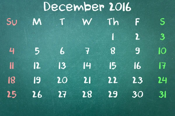Green blackboard wall texture with a word Calender 2016 December — Stock Photo, Image
