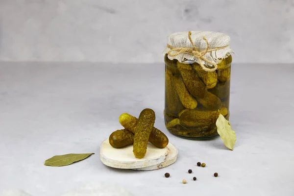 Pickled cucumbers in a glass jar on a light background. — Stock Image Pickled Cucumbers Glass Jar Light Background Stock Picture