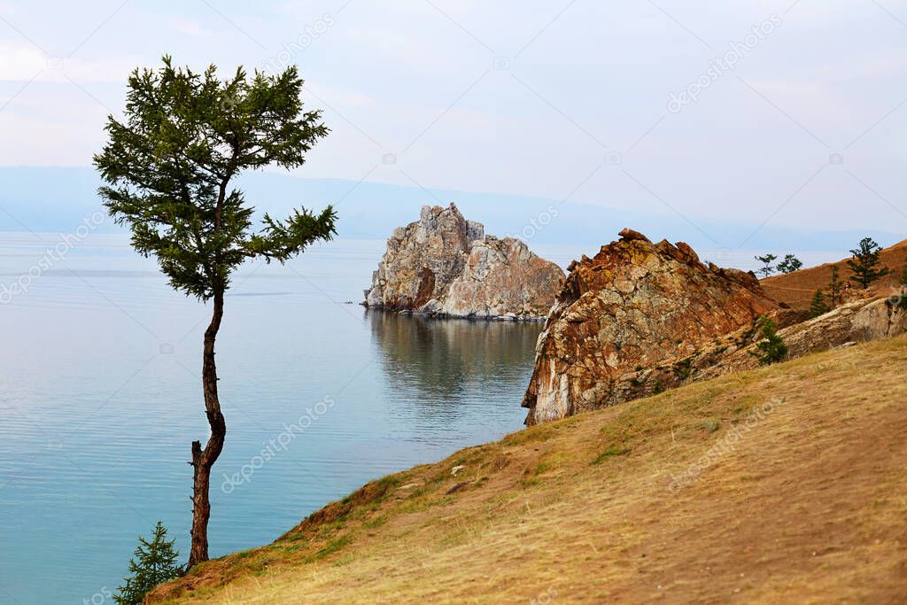 Beautiful view of Cape Burhan or Shamanka rock on Olkhon island. Lake Baikal in the summer evening. High quality photo