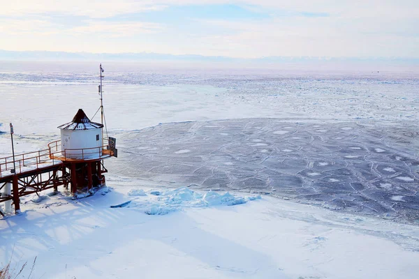 Beautiful landscape of the frozen Lake Baikal, village of Listvyanka — Stock Photo, Image