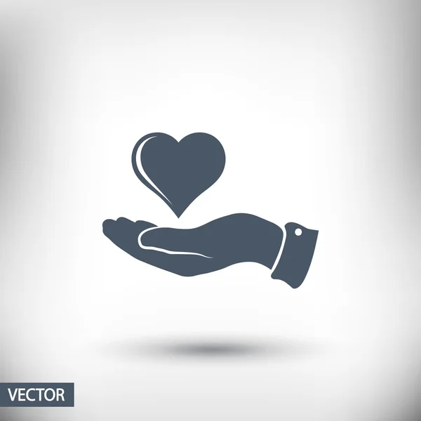 Corazón en la mano icono — Vector de stock