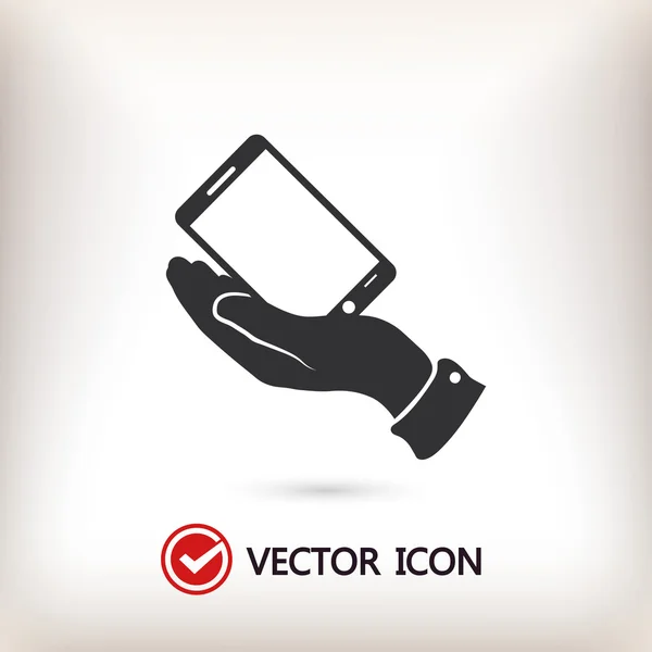 Smartphone en icono de la mano — Vector de stock