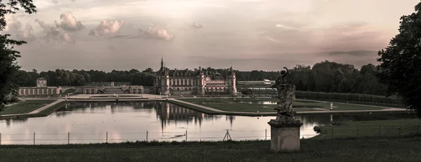 Chantilly castle panoramic view on sunset background — Stock Photo, Image