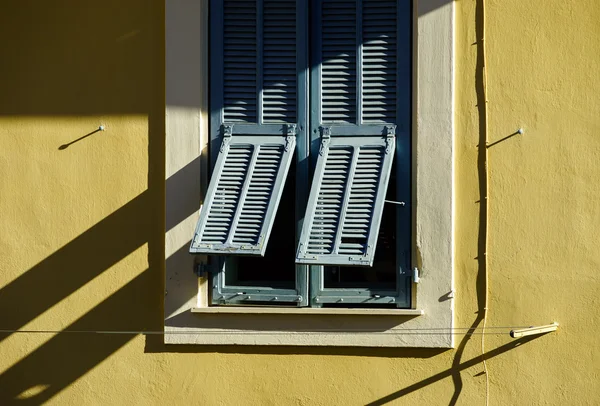 Shadows from the shutter on classic french or italian window — Stock Photo, Image