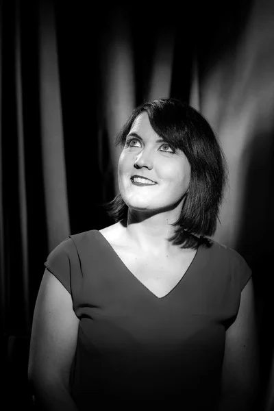 Retro-styled studio portrait of young woman — Stock Photo, Image