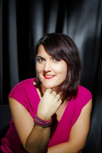 Retro-styled studio portrait of young woman — Stock Photo, Image