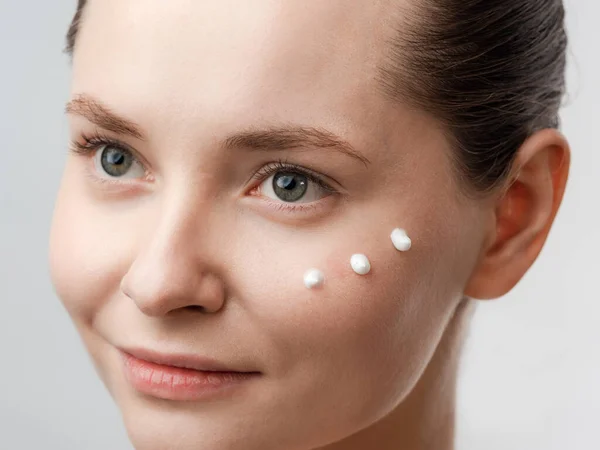 Beautiful Young Woman Clean Fresh Skin Drops Cream Applied Cheek — Stock Photo, Image