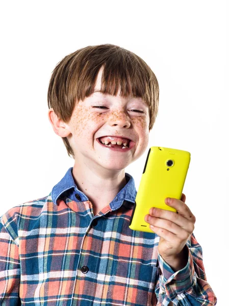 Red-haired funny boy with mobile phone — Stock Photo, Image