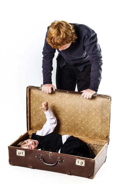 Two brothers playing with retro suitcase — Stock Photo, Image