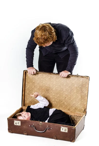 Two brothers playing with retro suitcase — Stock Photo, Image