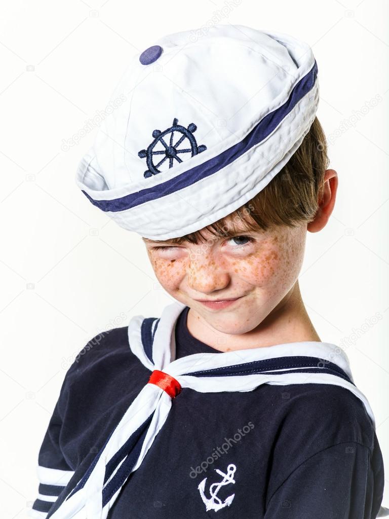 Cute little boy dressed in sailor suit