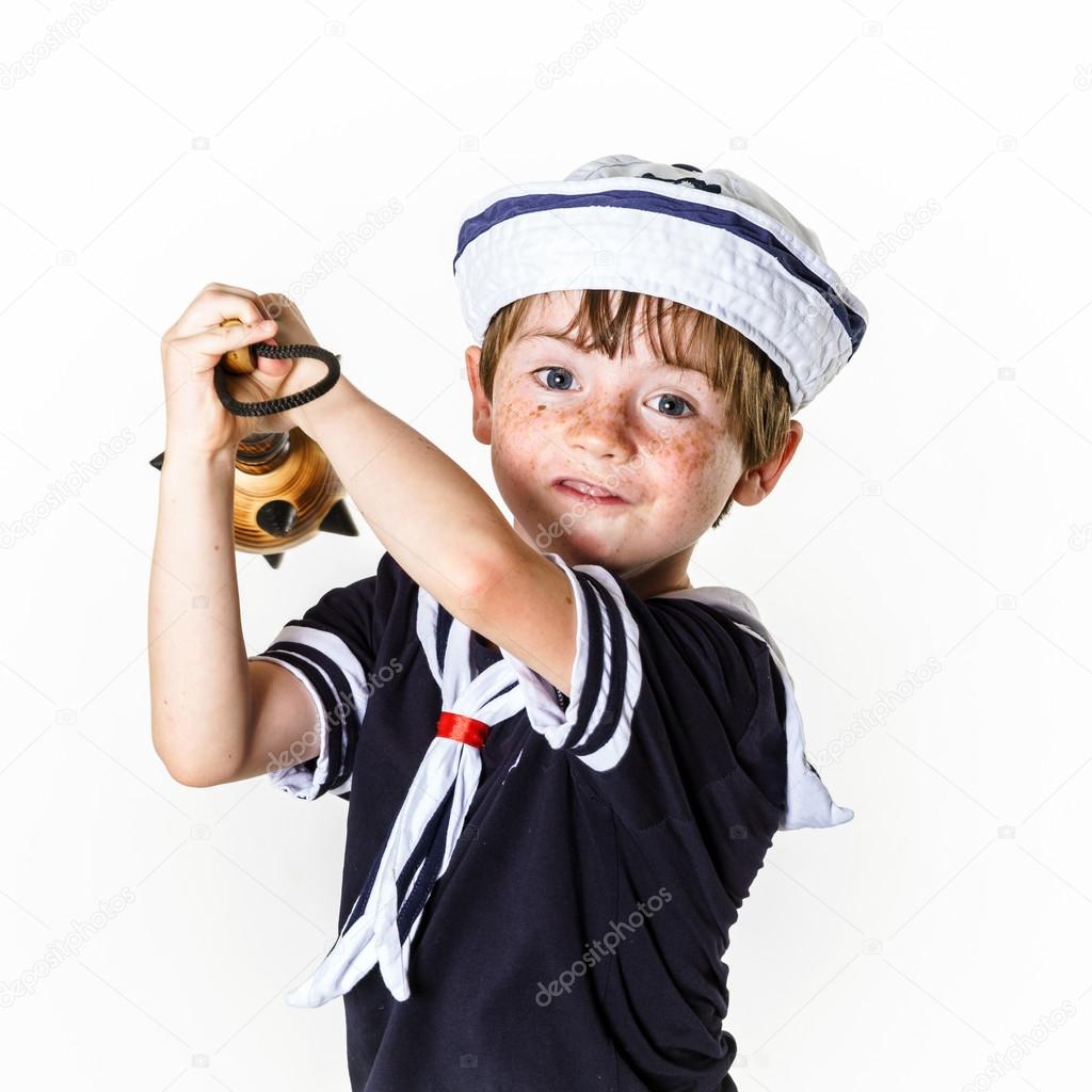 Cute little boy dressed in sailor suit