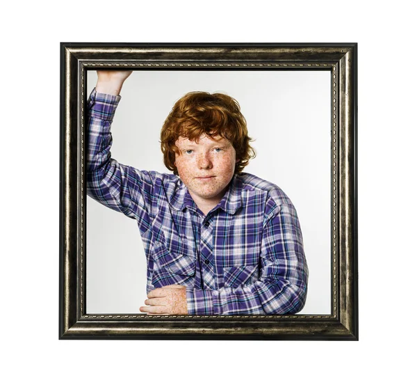 Red-haired boy posing with picture frame — Stock Photo, Image