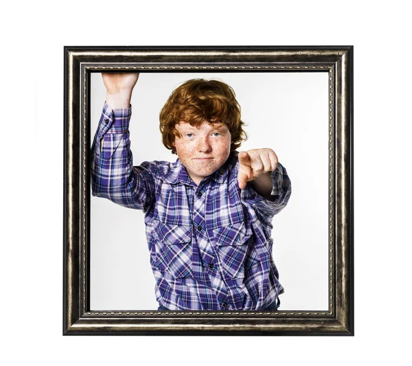 Red-haired boy posing with picture frame — Stock Photo, Image