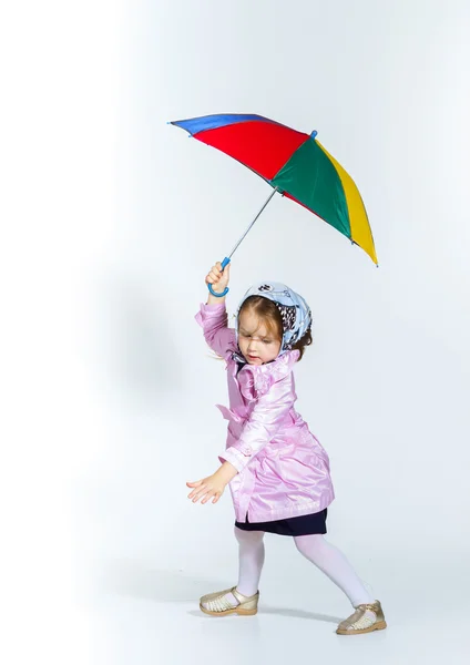 Cute little girl with colorful umbrella — Stock Photo, Image