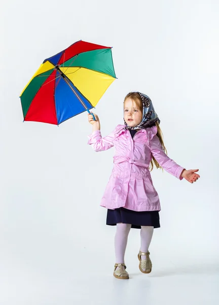 Cute little girl with colorful umbrella — Stock Photo, Image
