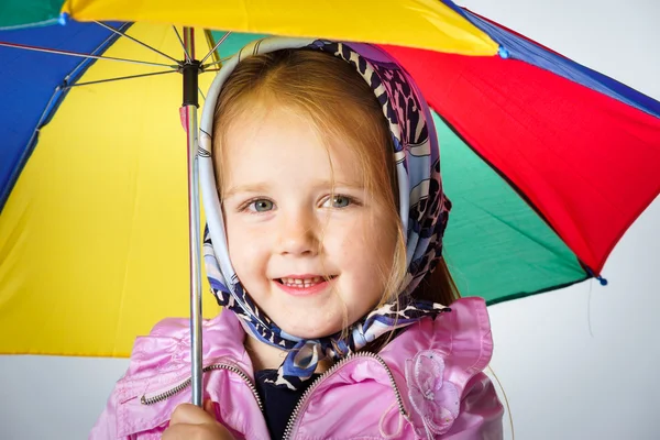 Cute little girl with colorful umbrella — Stock Photo, Image