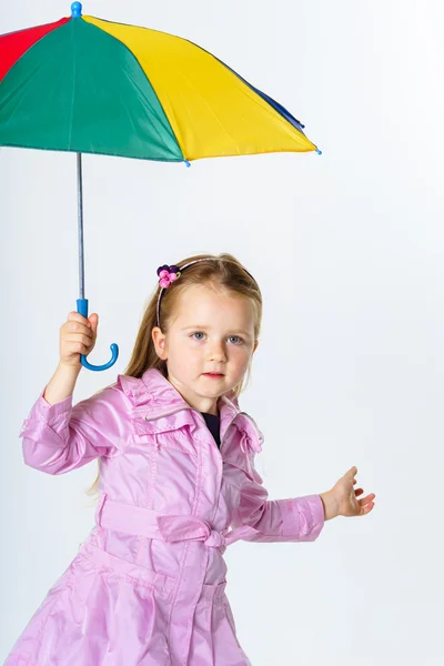 Cute little girl with colorful umbrella — Stock Photo, Image