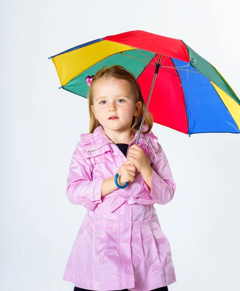 Cute little girl with colorful umbrella — Stock Photo, Image