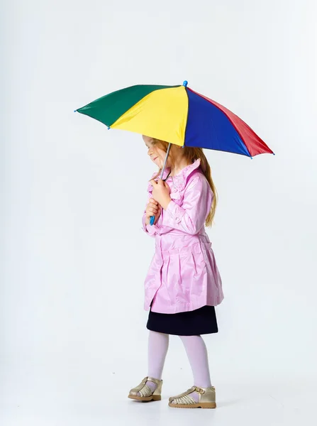 Cute little girl with colorful umbrella — Stock Photo, Image