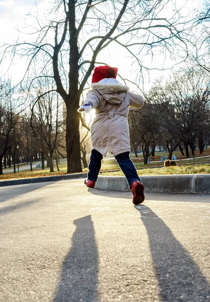 Cute little girl playing on child playground in public park — Stock Photo, Image