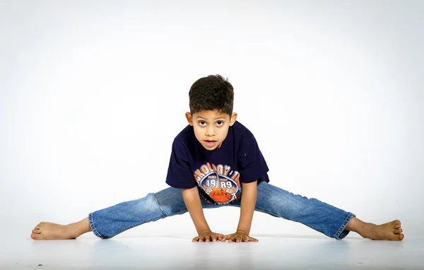 Young active afro-american boy doing gymnastics — Stock Photo, Image