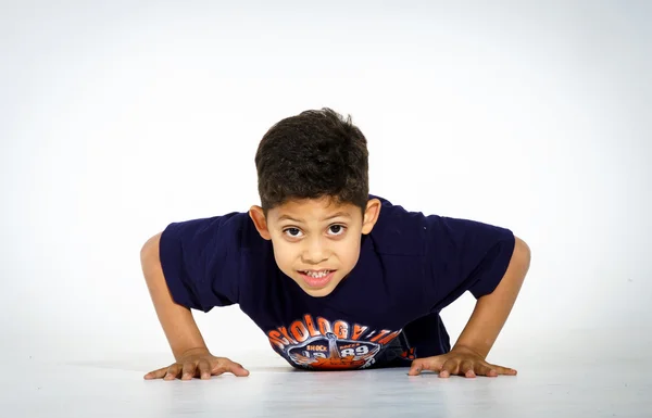 Young active afro-american boy doing gymnastics — Stock Photo, Image