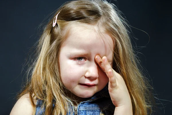 Crying blond little girl with focus on her tears — Stock Photo, Image