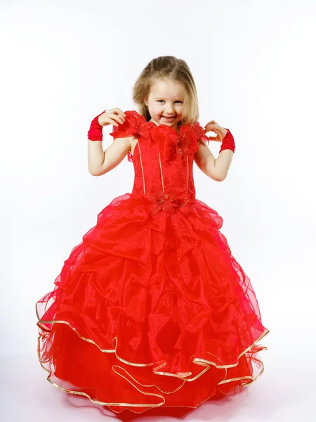 Cute little princess dressed in red dancing. Isolated on white b — Stock Photo, Image