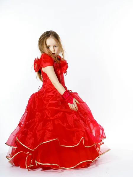 Cute little princess dressed in red dancing. Isolated on white b — Stock Photo, Image