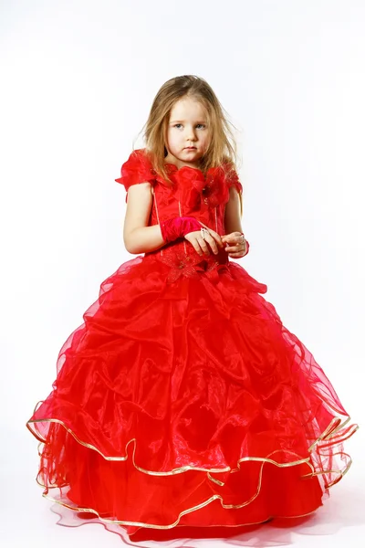 Cute little princess dressed in red dancing. Isolated on white b — Stock Photo, Image